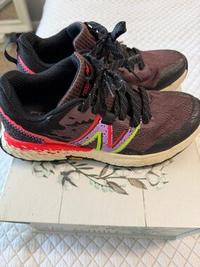 New Balance Black Athletic Sneaker with Subtle Pink Accent